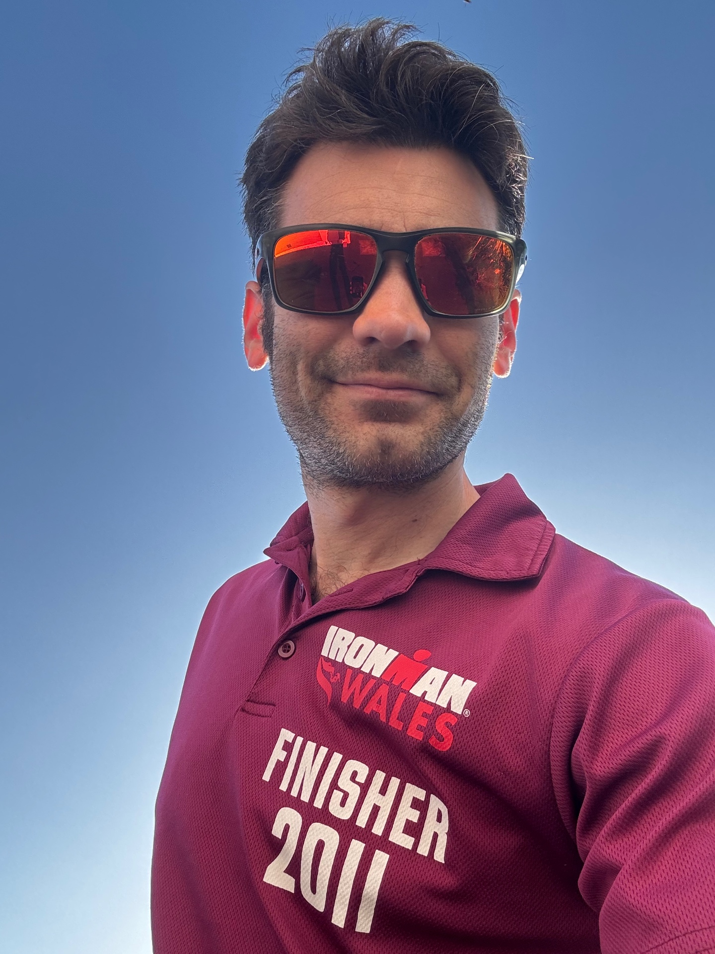 Nick wearing an Ironman Wales finisher polo
