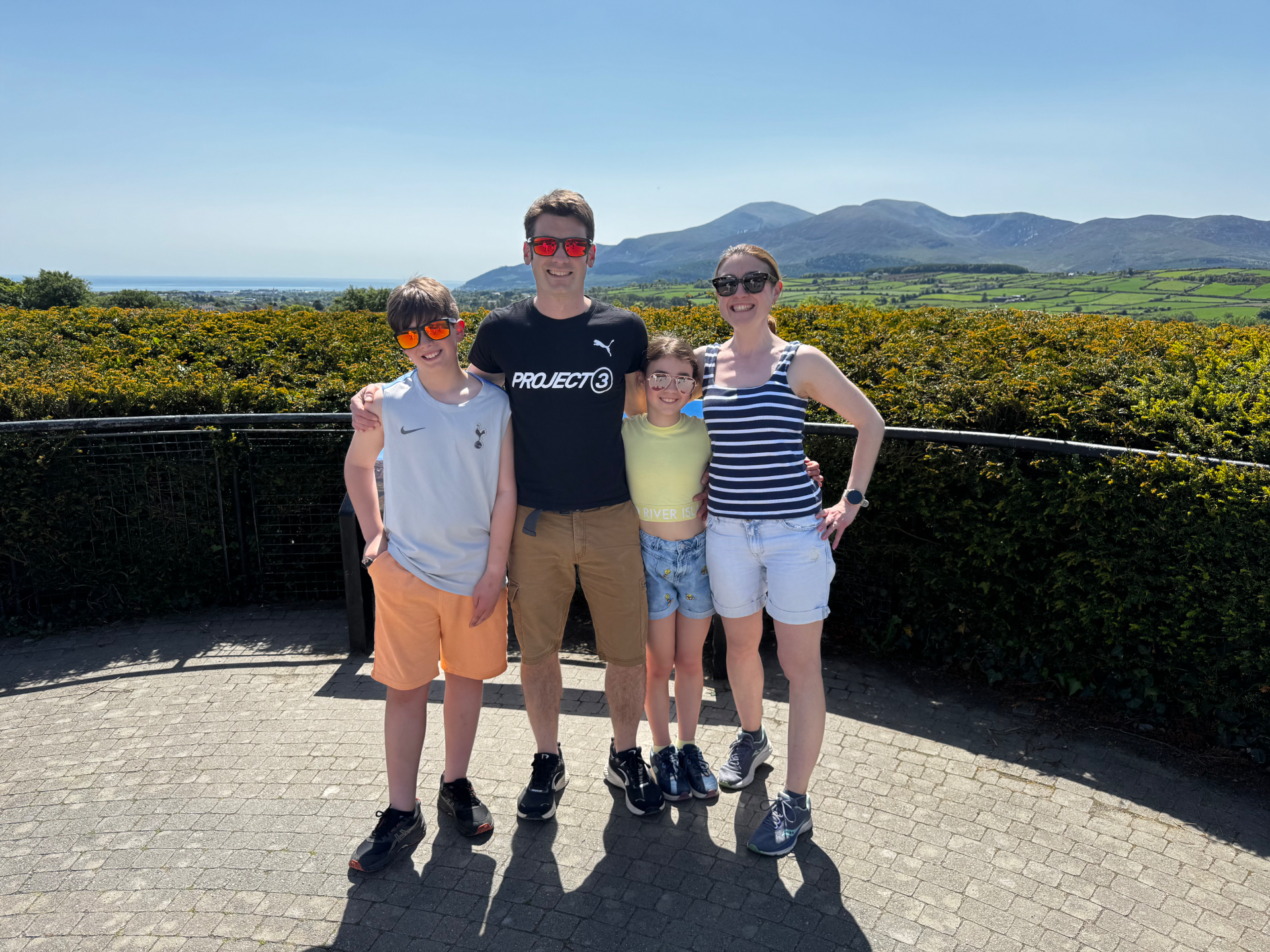 Nick with his wife and two children, Mourne Mountains in the background