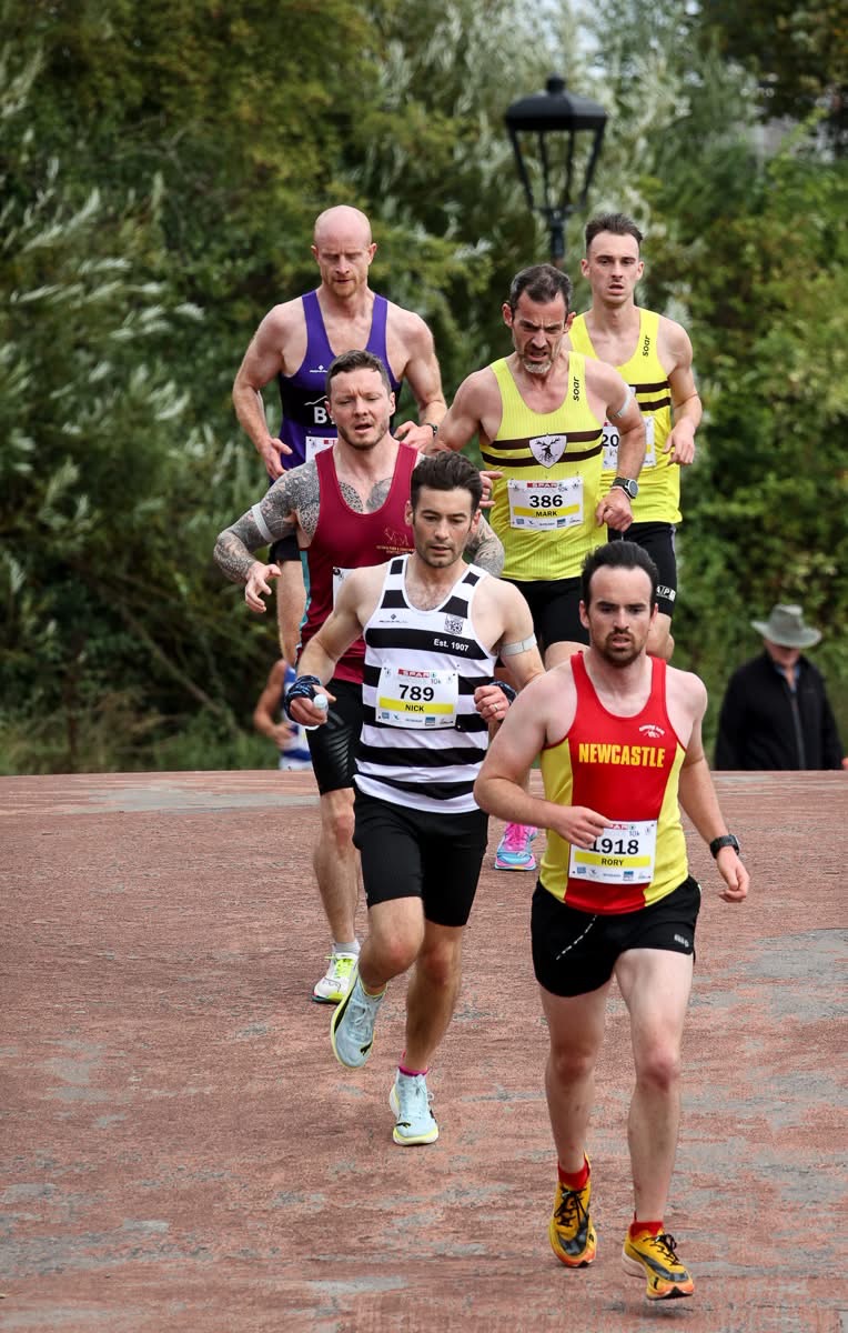 A group of runners in a V formation to beat the wind